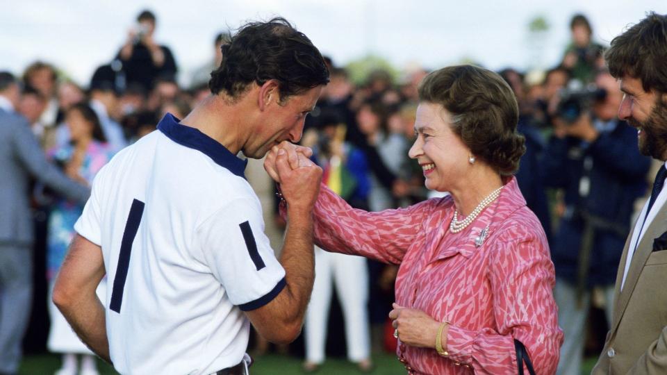 charles kissing hand of his mother at polo 