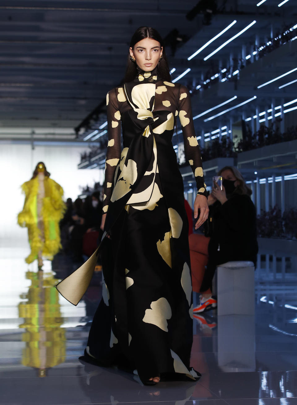 A model wears a creation as part of the Daniel Del Core women's and men's Fall Winter 2021-22 collection, unveiled during the Fashion Week in Milan, Italy, Wednesday, Feb. 24, 2021. (AP Photo/Antonio Calanni)