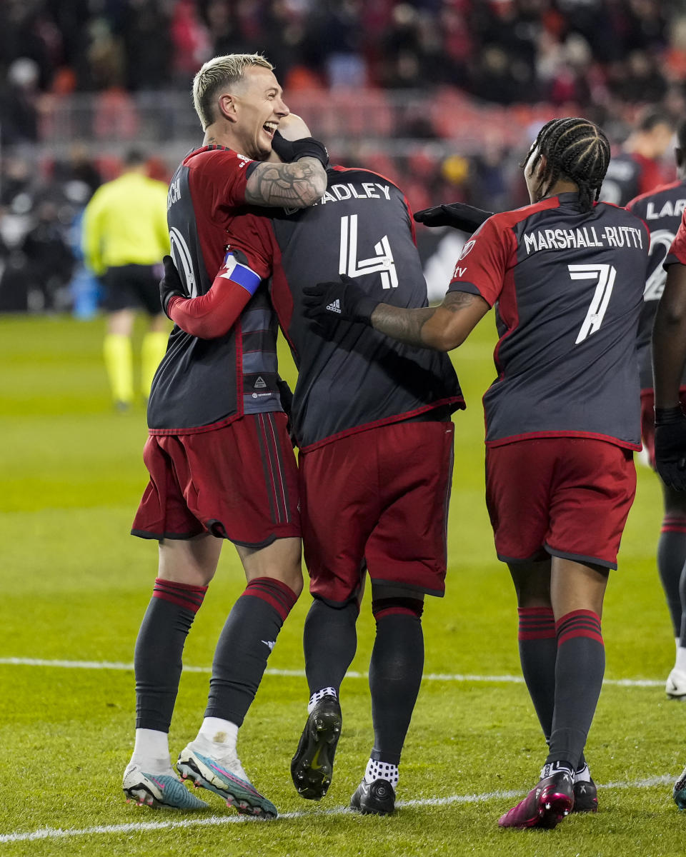 Toronto FC forward Federico Bernardeschi (10) celebrates a goal by midfielder Michael Bradley (4) against Charlotte FC during the first half of an MLS soccer match Saturday, April 1, 2023, in Vancouver, British Columbia. (Andrew Lahodynskyj/The Canadian Press via AP)