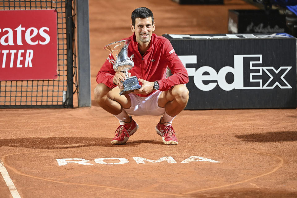 Serbia's Novak Đjoković poses with his trophy after winning winning his match with Argentina's Diego Sebastián Schwartzman during their final match at the Italian Open tennis tournament, in Rome, Monday, Sept. 21, 2020. (Alfredo Falcone/LaPresse via AP)