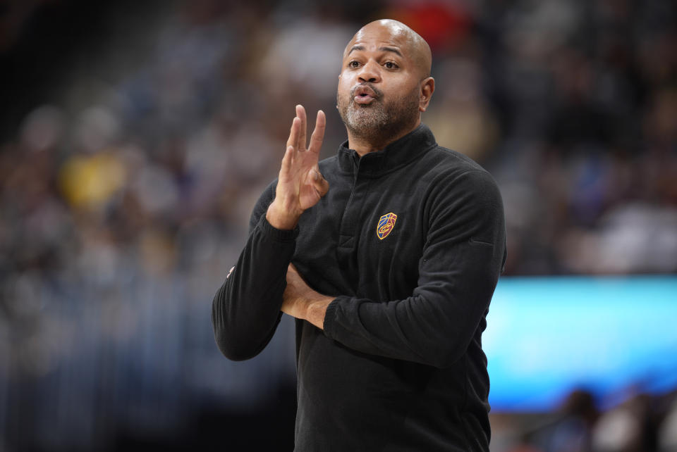 Cleveland Cavaliers head coach J.B. Bickerstaff directs his team against the Denver Nuggets in the first half of an NBA basketball game Monday, Oct. 25, 2021, in Denver. (AP Photo/David Zalubowski)
