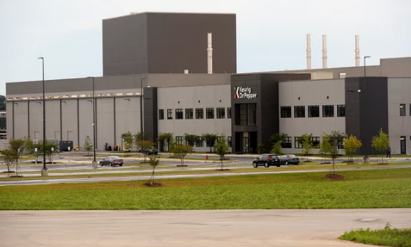 Keurig Dr. Pepper plans to investing another $100 million and create 250 new jobs at its Spartanburg County facility by 2027, officials announced Thursday.