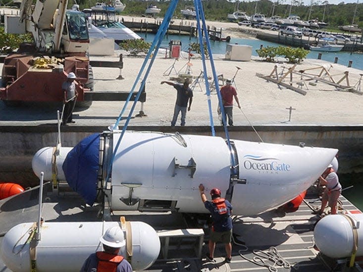 The Titan being lowered onto the platform in a harbour.