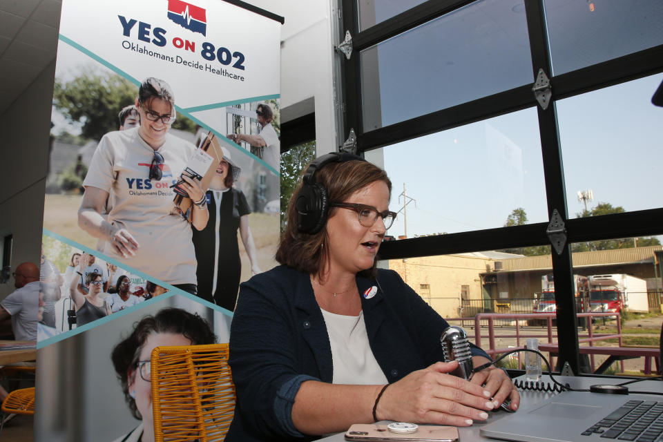 Amber England, campaign manager, Yes on 802, addresses supporters via the internet Tuesday, June 30, 2020, in Oklahoma City, as due to Covid-19 concerns, a virtual watch party replaces the normal watch party, as they await results in a vote in which Oklahoma voters are deciding whether to amend the state Constitution to expand Medicaid health coverage to tens of thousands of low-income residents. (AP Photo/Sue Ogrocki)