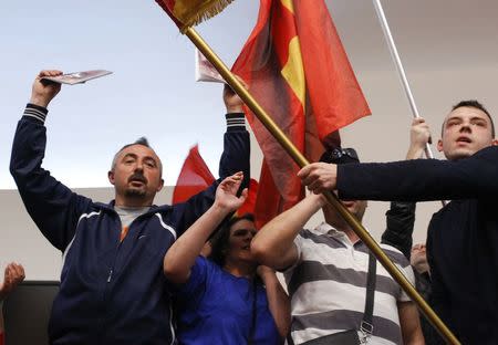 Protesters entered Macedonia's parliament after the governing Social Democrats and ethnic Albanian parties voted to elect an Albanian as parliament speaker in Skopje. Macedonia April 27, 2017. REUTERS/Ognen Teofilovski