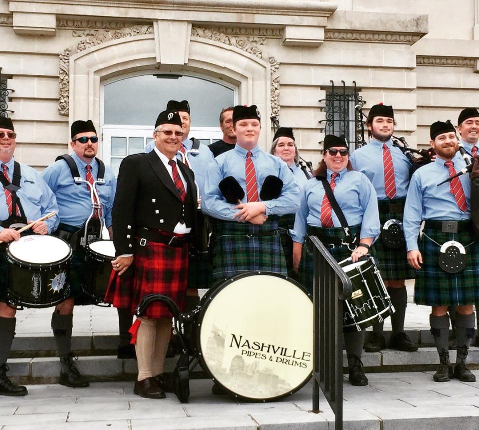 Dr. Stephen Porter, founder and co-owner of Asgard Brewing Co. & Taproom, joins Nashville Pipes and Drums on the Maury County Courthouse steps.