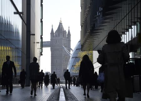 City workers head to work during the morning rush hour in Southwark in central London April 16, 2014. REUTERS/Toby Melville