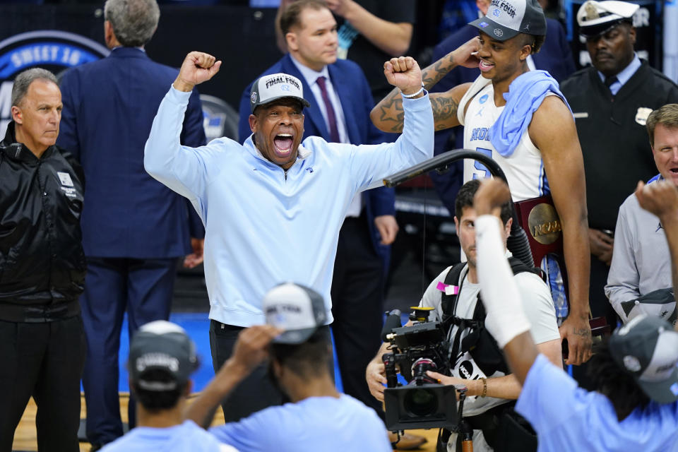 North Carolina head coach Hubert Davis celebrates after North Carolina won a college basketball game against St. Peter's in the Elite 8 round of the NCAA tournament, Sunday, March 27, 2022, in Philadelphia. (AP Photo/Matt Rourke)