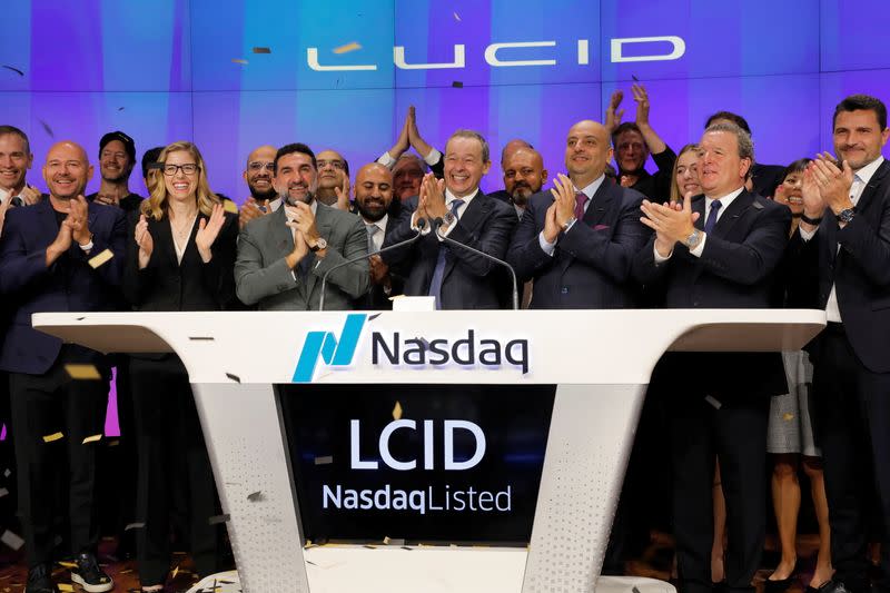 Lucid Motors CEO Peter Rawlinson claps after ringing the opening bell at the Nasdaq MarketSite in New York City