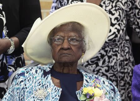 Jeralean Talley sits at the head table during a celebration of her 115th birthday at the New Jerusalem Missionary Baptist Church in Inkster, Michigan in this file photo taken May 25, 2014. REUTERS/Rebecca Cook/Files