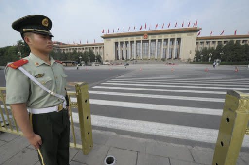 A paramilitary policeman stands guard at Tiananmen Square opposite the Great Hall of the People in Beijing. China has increasingly become a focus of Republican attacks with Mitt Romney vowing a harder line on issues including trade, human rights and the military balance