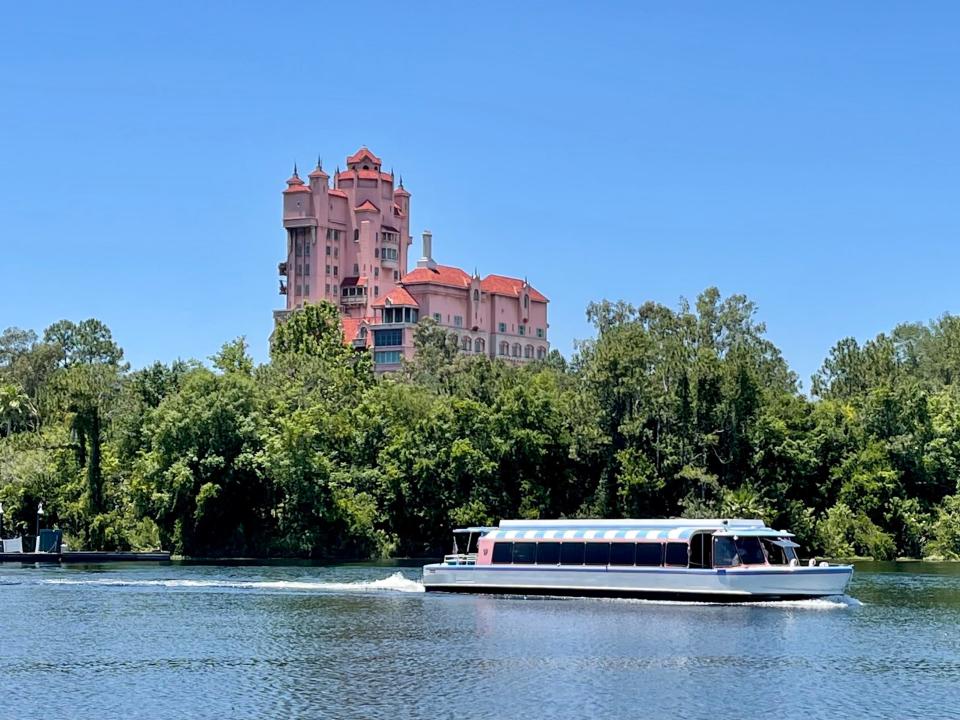 friendship boat traveling in front of tower of terror disney world