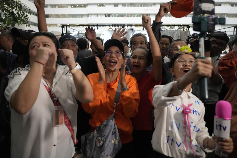 Supporters of Pita Limjaroenrat celebrate at Constitutional Court in in Bangkok, Thailand, Wednesday, Jan. 24, 2024. The court ruled Wednesday that popular politician Pita, who was blocked from becoming prime minister even though his party placed first in last year’s election, did not violate the election law and can retain his seat in Parliament. (AP Photo/Sakchai Lalit)