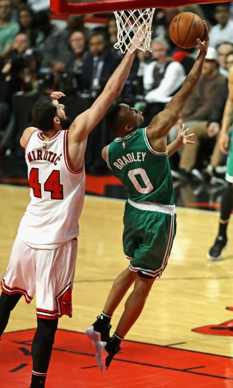 Avery Bradley of the Boston Celtics drives past Nikola Mirotic of the Chicago Bulls on his way to a team-high 23 points during Game Six of the Eastern Conference Quarterfinals