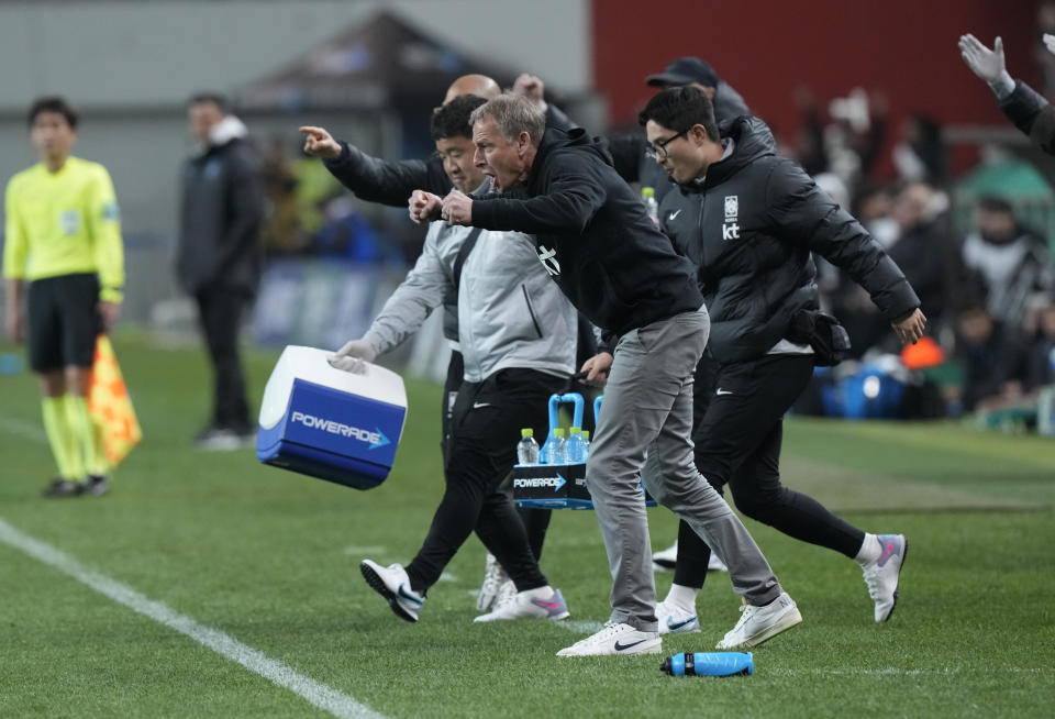 South Korea's head coach Jurgen Klinsmann, center, celebrates after Hwang In-beom scored during an international friendly soccer match between South Korea and Uruguay in Seoul, Sough Korea, Tuesday, March 28, 2023. (AP Photo/Ahn Young-joon)