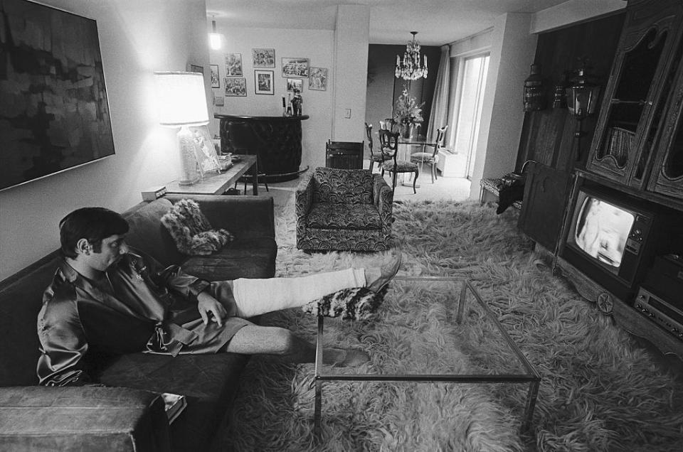 <p>New York Jets quarterback Joe Namath rests in his Upper East Side apartment in January 1968, while recovering from an injury. He retired from football a year and a half later.</p>