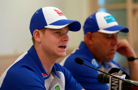 Australian cricket captain Steve Smith (L) speaks at a news conference in Mumbai, India, February 14, 2017. REUTERS/Danish Siddiqui