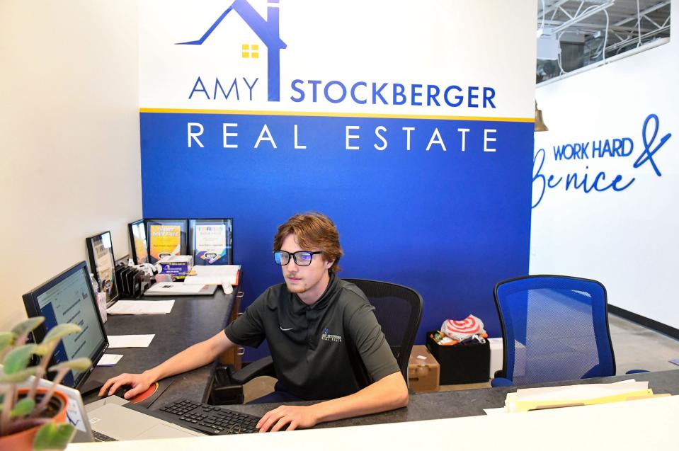 Jersey Fink works at the front desk on Wednesday, June 15, 2022, at Amy Stockberger Real Estate in Sioux Falls.