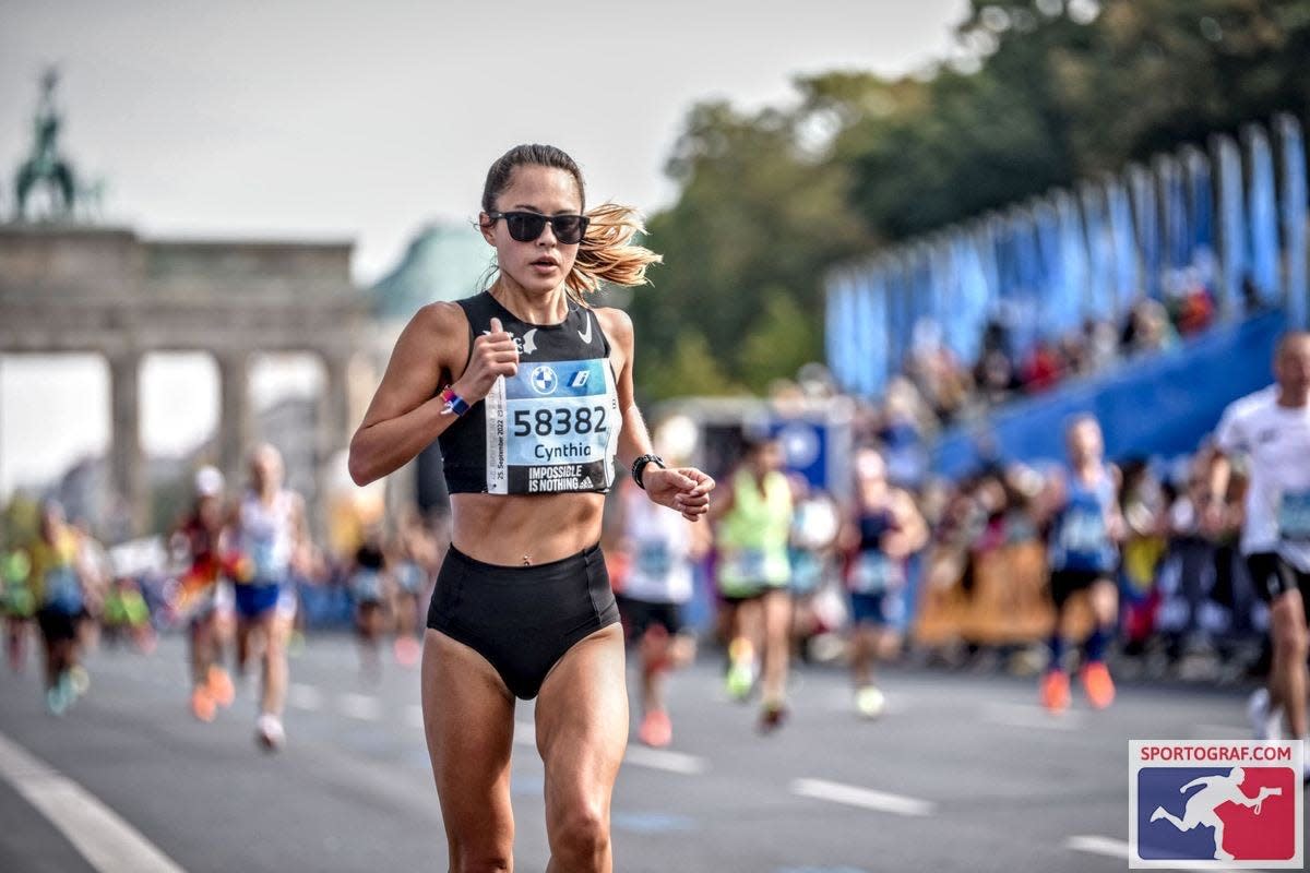 Cynthia Holderer of Austin, Texas finishes a 2022 marathon in Berlin, Germany, where she ran her personal best of 2:46:28. The mother of 10-week-old son Max says she began training soon after childbirth for this fall’s Detroit Free Press Marathon.