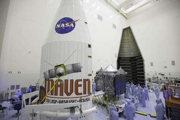 Inside the Payload Hazardous Servicing Facility at NASA's Kennedy Space Center in Florida, engineers and technicians prepare the MAVEN spacecraft for encapsulation inside its payload fairing.