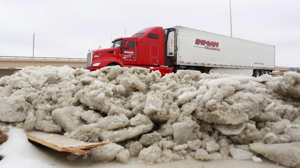 Ice piled on the shoulder of I-20 near Hulen Mall in Fort Worth on Sunday, Dec. 8, 2013.