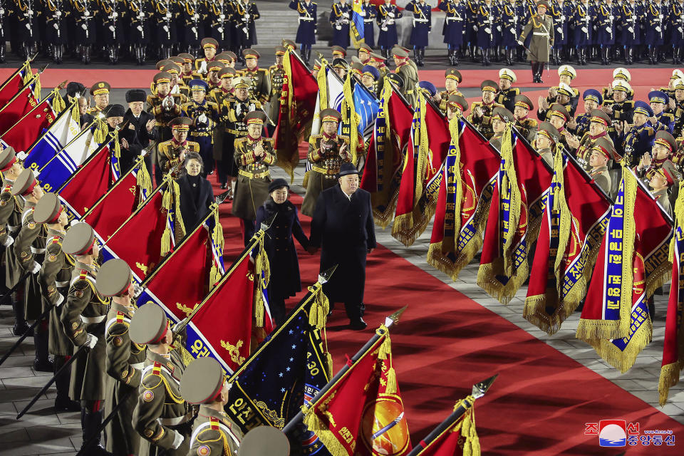 In this photo provided by the North Korean government, North Korean leader Kim Jong Un, center right, reviews an honor guard with his daughter, center left, and his wife Ri Sol Ju during a military parade to mark the 75th founding anniversary of the Korean People’s Army on Kim Il Sung Square in Pyongyang, North Korea Wednesday, Feb. 8, 2023. Independent journalists were not given access to cover the event depicted in this image distributed by the North Korean government. The content of this image is as provided and cannot be independently verified. Korean language watermark on image as provided by source reads: "KCNA" which is the abbreviation for Korean Central News Agency. (Korean Central News Agency/Korea News Service via AP)