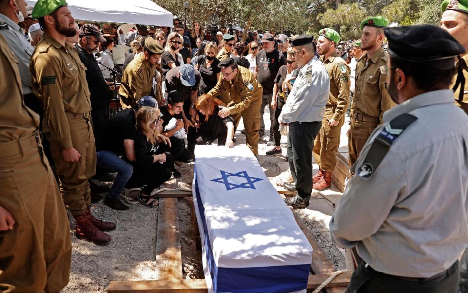 Israeli mourners attend the funeral of Israeli soldier Omer Tabib, 21, in Elyakim in northern Israel - AFP