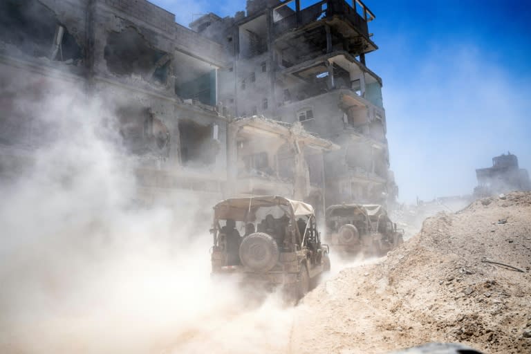 Foreign news outlets are occasionally invited by Israeli authorities on observation tours of Gaza, although independent reporting from inside the war-ravaged enclave is difficult of soldiers and journalists inside the southern Gaza Strip on July 3, 2024 (Ohad Zwigenberg)