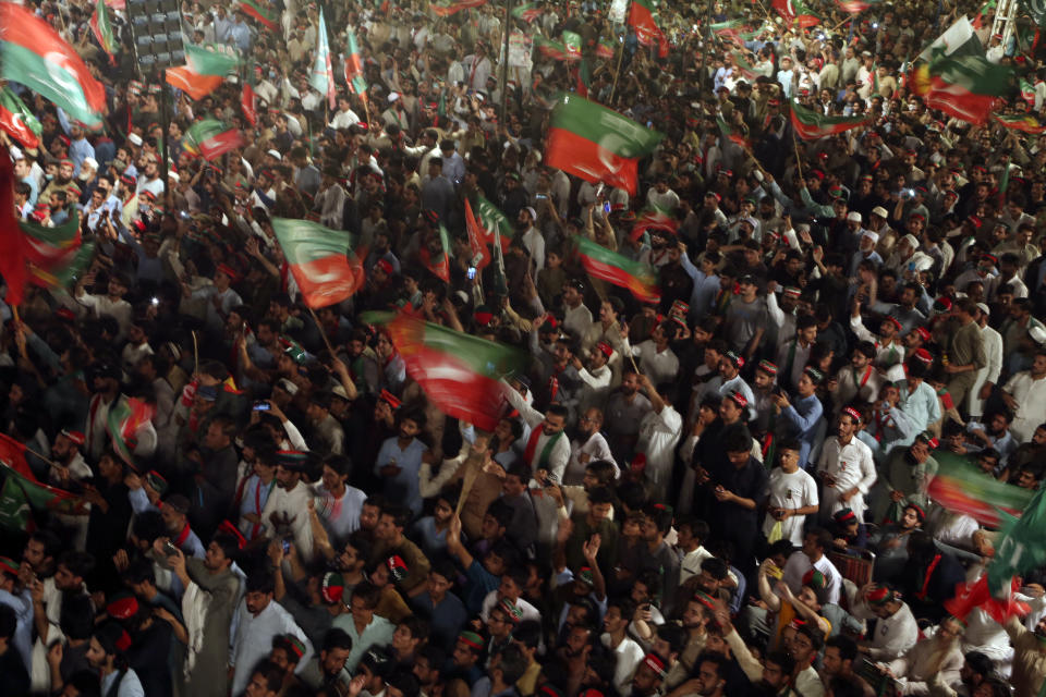 Supporters of Pakistani opposition leader Imran Khan's Tehreek-e-Insaf party attend a rally, in Peshawar, Pakistan, Tuesday, Sept. 6, 2022. Since he was toppled by parliament five months ago, former Prime Minister Imran Khan has demonstrated his popularity with rallies that have drawn huge crowds and signaled to his rivals that he remains a considerable political force. (AP Photo/Mohammad Sajjad)