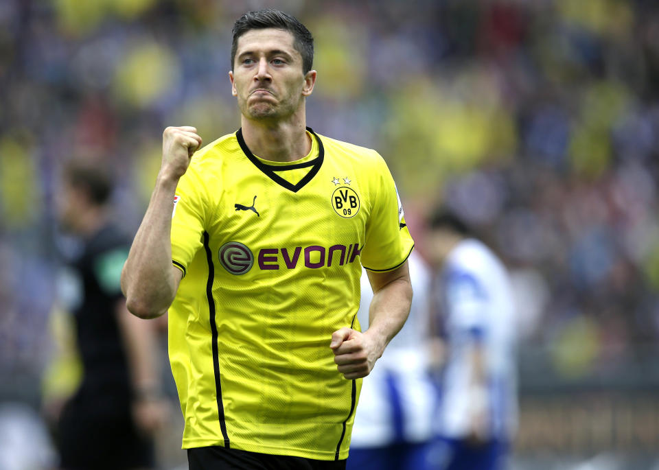 Dortmund's Robert Lewandowski of Poland celebrates scoring his side's opening goal during the German Bundesliga soccer match between Hertha BSC Berlin and Borussia Dortmund in in Berlin, Germany, Saturday, May 10, 2014. (AP Photo/Michael Sohn)