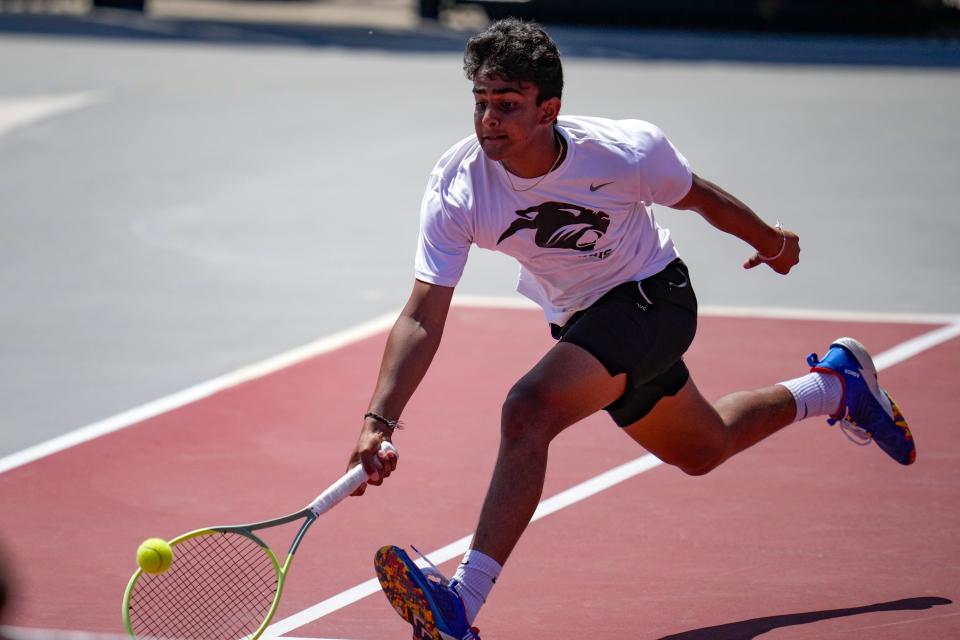 Pickerington North’s Pavan Uppu goes for a return during the Division I state singles final against Gahanna Lincoln’s Brandon Carpico.