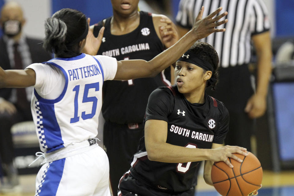 South Carolina's Destanni Henderson, right, is pressured by Kentucky's Chasity Patterson, left, during the second half of an NCAA college basketball game in Lexington, Ky., Sunday, Jan. 10, 2021. (AP Photo/James Crisp)