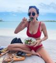 <p>While traveling in the Maldives, the <i>Vampire Diaries</i> alum is still making sure to eat lots of greens! In a <a href="https://www.instagram.com/p/CfCWcN8OzPL/?utm_source=ig_web_copy_link" rel="nofollow noopener" target="_blank" data-ylk="slk:collection shared on Instagram;elm:context_link;itc:0;sec:content-canvas" class="link ">collection shared on Instagram</a>, <a href="https://people.com/tag/nina-dobrev/" rel="nofollow noopener" target="_blank" data-ylk="slk:Dobrev;elm:context_link;itc:0;sec:content-canvas" class="link ">Dobrev</a> is chowing down on a salad while wearing a red bikini.</p>