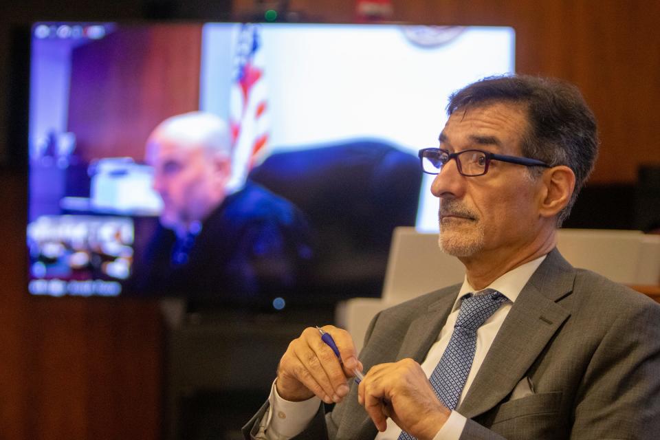 John Nicodemo, the deputy attorney general and prosecuting attorney, listens to Lee Vartan, defense attorney, speak during Rabbi Osher Eisemann's motion for a new trial before Superior Court Judge Joseph Paone at Middlesex County Courthouse in New Brunswick, NJ Friday, July 8, 2022. 