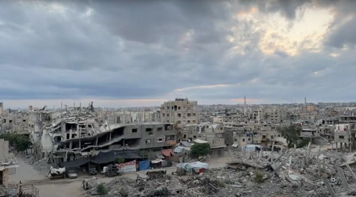 Sun rises over wreckage of bombed buildings in Khan Younis, Gaza