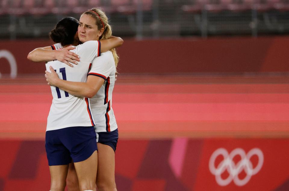Christen Press, left, and Lindsay Horan console each other after the U.S. lost to Canada in the semifinals at the Tokyo Olympics.