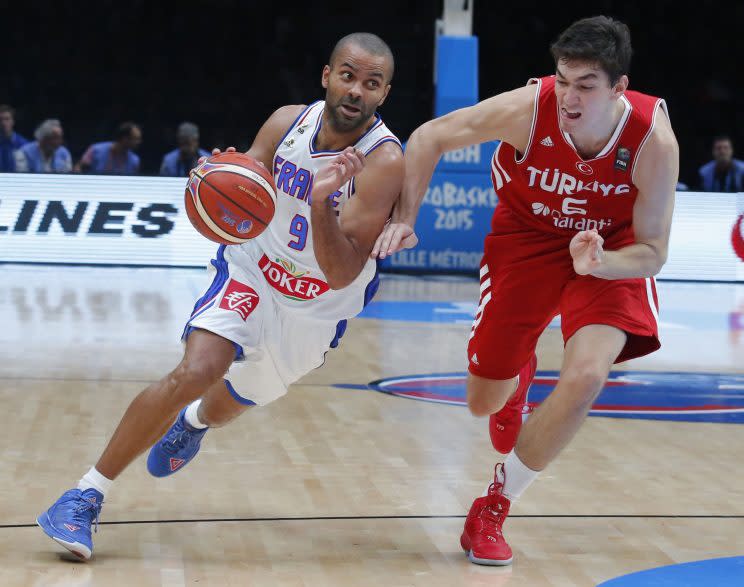 Spurs point guard Tony Parker drives past new Cavaliers wing Cedi Osman during the 2016 Olympics. (AP)