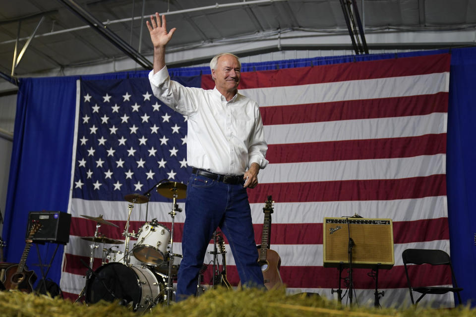 Republican presidential candidate former Arkansas Gov. Asa Hutchinson waves to the audience during a fundraising event for U.S. Rep. Ashley Hinson, R-Iowa, Sunday, Aug. 6, 2023, in Cedar Rapids, Iowa. (AP Photo/Charlie Neibergall)