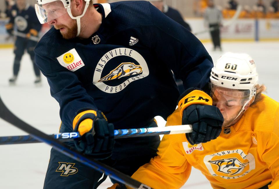 Blue's Luke Prokop (91) and Gold's Chase McLane (60) compete for the puck during the Nashville Predators 2023 development camp at Ford Ice Center Bellevue Thursday, July 6, 2023.