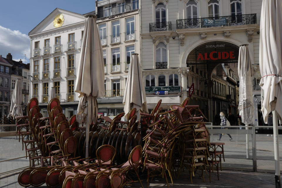 FILE - In this March 19, 2021, file photo, stacked chairs in front of a cafe during the coronavirus pandemic in Lille, northern France. Lofty hopes that the crisis would encourage a new and tighter bloc to face a common challenge have given way to the reality of division: The pandemic has set member nation against member nation, and many capitals against the EU itself, as symbolized by the disjointed, virtual meetings leaders now hold. (AP Photo/Michel Spingler, File)