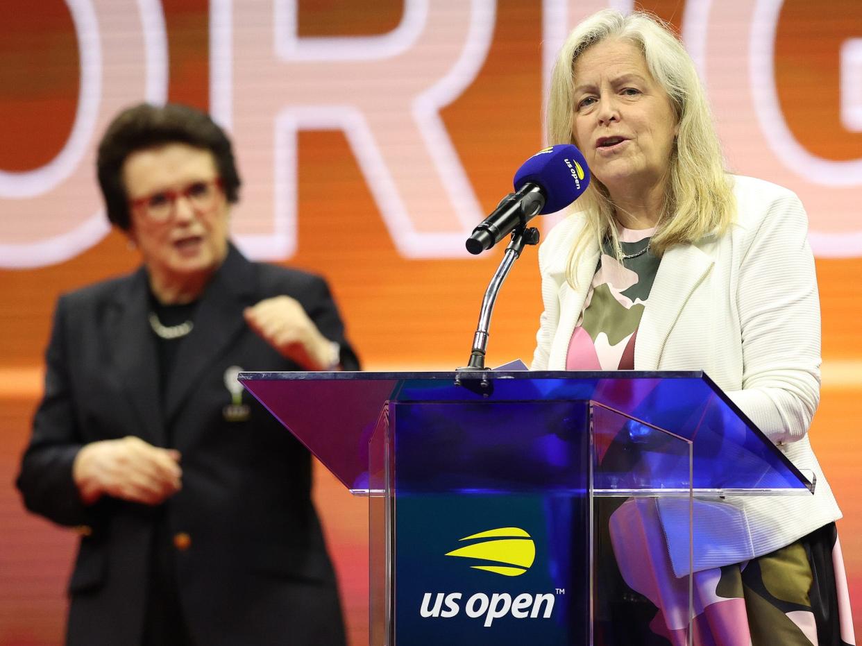 US Open Tournament Director Stacey Allaster (right) speaks at the ceremony honoring the induction of the Original 9 into the International Tennis Hall of Fame as King looks on during the 2021 US Open.