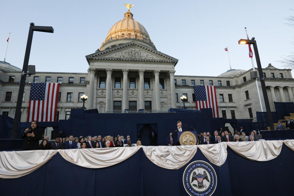 Gov. Tate Reeves addresses a joint session of the Legislature outside the Capitol as he delivers his first State of the State address in Jackson, Miss., Monday, Jan. 27, 2020. (AP Photo/Rogelio V. Solis)