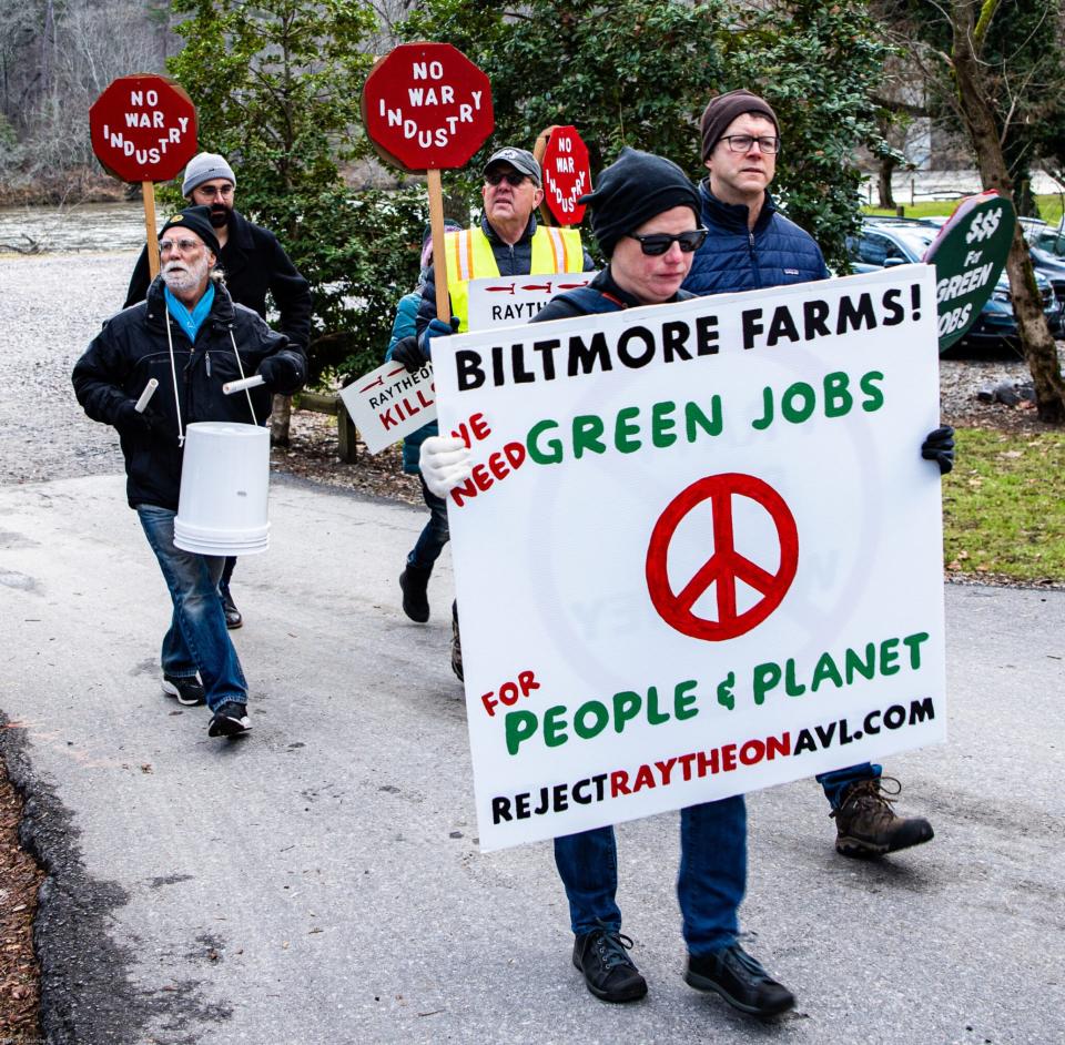 Protesters with Reject Raytheon Asheville at the Nov. 16 ribbon cutting of the new Pratt & Whitney facility.