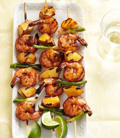 <p>For this flame-fired dish, shrimp and ripe peaches (plus the carmelized juices) are seasoned with a smoky cumin-and-chile rub.</p><p><em><a href="https://www.goodhousekeeping.com/food-recipes/a10965/barbecued-shrimp-peach-kabobs-recipe-ghk0711/" rel="nofollow noopener" target="_blank" data-ylk="slk:Get the recipe for Barbecued Shrimp and Peach Kabobs »;elm:context_link;itc:0;sec:content-canvas" class="link ">Get the recipe for Barbecued Shrimp and Peach Kabobs »</a></em></p><p><strong>RELATED:</strong> <a href="https://www.goodhousekeeping.com/food-recipes/cooking/g27556949/types-of-peaches/" rel="nofollow noopener" target="_blank" data-ylk="slk:The 4 Types of Peaches You'll Be Eating All Summer Long;elm:context_link;itc:0;sec:content-canvas" class="link ">The 4 Types of Peaches You'll Be Eating All Summer Long</a></p>