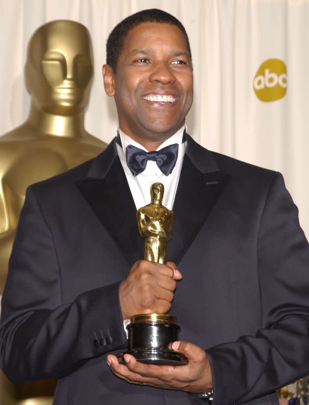 Denzel Washington holds his Oscar for Best Actor for 