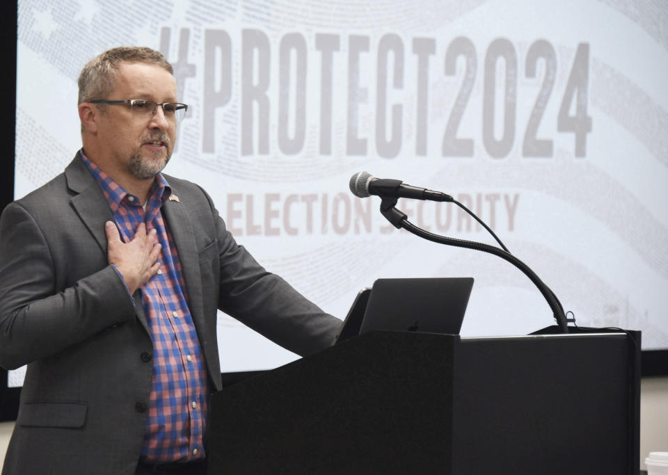 Spencer Wood, a regional election security advisor with the U.S. Cybersecurity and Infrastructure Security Agency, addresses election workers, staff and law enforcement April 10, 2024, at a Committee of Safe and Secure Elections conference in Traverse City, Mich. A top concern for local election workers throughout the country this year is their own safety. The committee, formed after the 2020 presidential election, is traveling the country helping them prepare for what could lie ahead. Wood told the attendees they were not facing the threats alone and praised them as the “frontline defenders” of the nation’s elections. (AP Photo/John L. Russell)