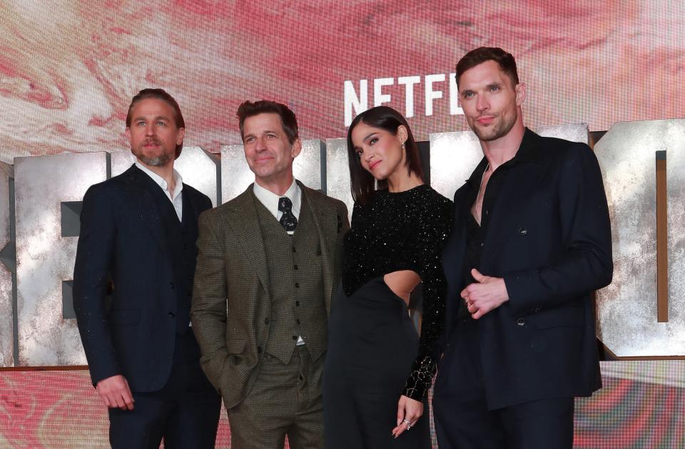 Director Zack Snyder on the red carpet with the stars of "Rebel Moon" Charlie Hunnam, Sofia Boutella, and Ed Skrein.