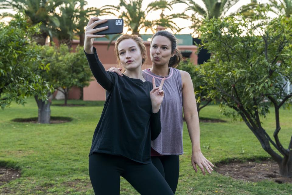 Rachel and Anna's characters taking a selfie outside