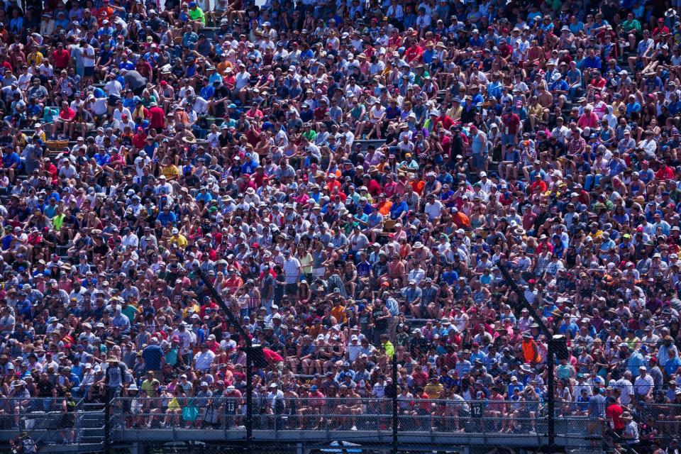 Fans watch from turn one Sunday, May 29, 2022, during the 106th running of the Indianapolis 500 at Indianapolis Motor Speedway.