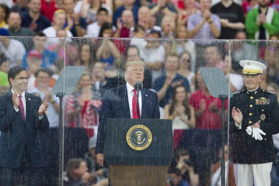 Acting Secretary of Defense Mark Esper, left, and Joint Chiefs Chairman Gen. Joseph Dunford, right, applaud as President Donald Trump pauses while speaking during an Independence Day celebration in front of the Lincoln Memorial, Thursday, July 4, 2019, in Washington. (AP Photo/Alex Brandon)